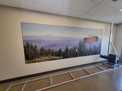 A beautiful landscape with the words Welcome to Northern Gold Foods has been printed on the wall with the surface ink vertical printer